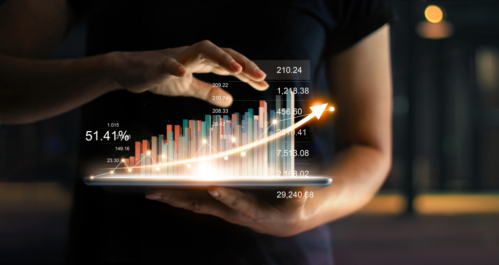 businessman-tablet-showing-growing-virtual-hologram